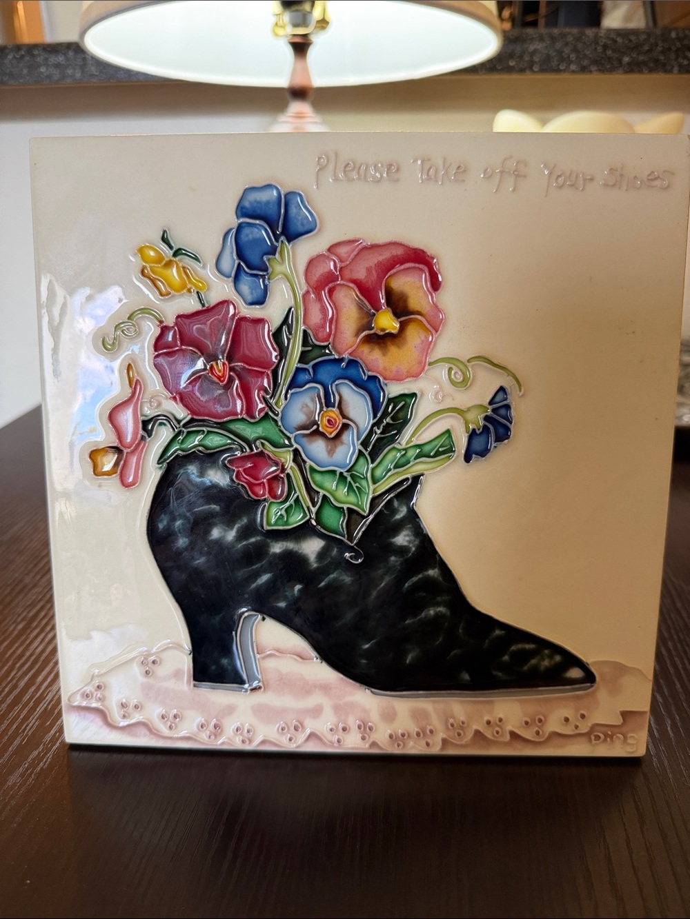 Ceramic Painted Tile Featuring Pancies and Black Boot. “Please Take Off Shoes”